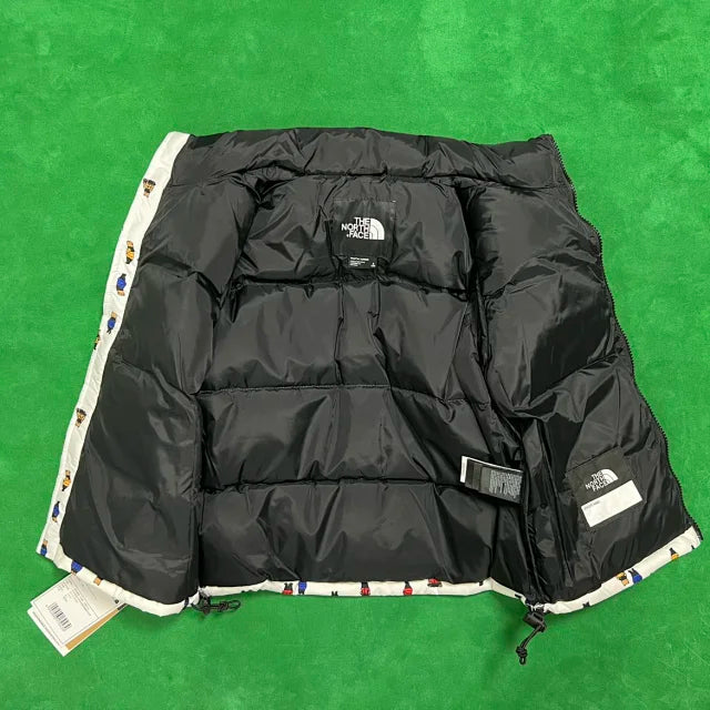 Puffer The North Face Jacket with a bear pattern