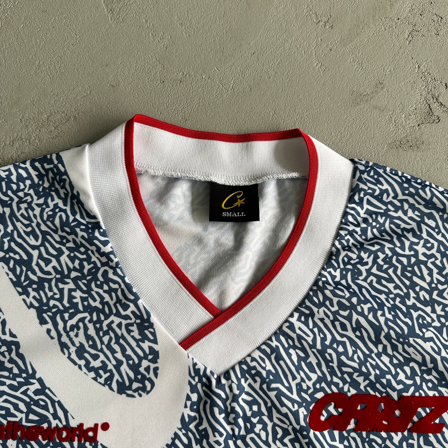 Blue and white all-over printed football uniform