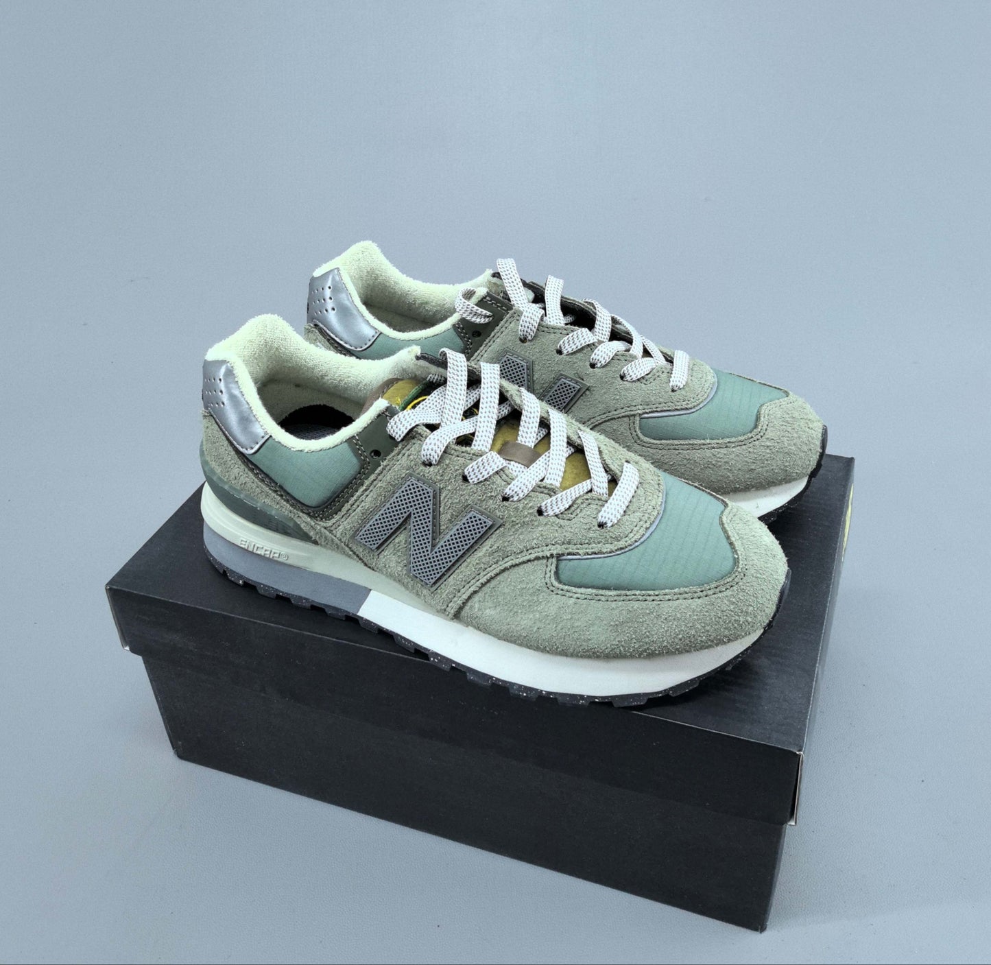 574 Legacy Stone Island